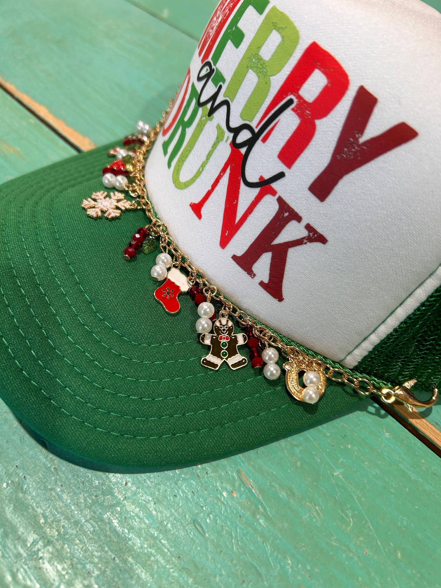 Perfect for celebrating the season! Merry and Drunk Christmas Trucker Hat includes Christmas Chain